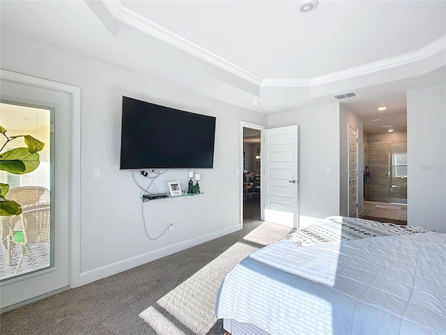 carpeted bedroom featuring ensuite bathroom, crown molding, and a tray ceiling