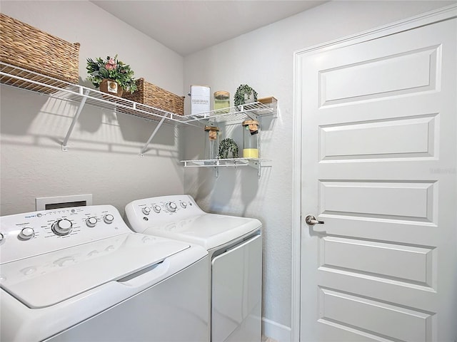 laundry room featuring washer and clothes dryer