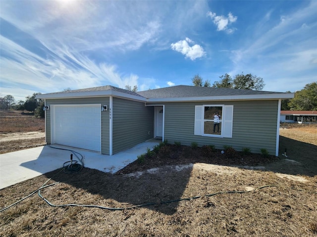 single story home with a garage