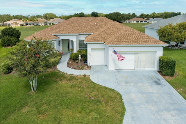 ranch-style house with a garage and a front lawn