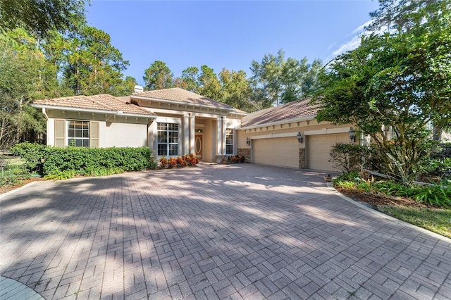 mediterranean / spanish-style house featuring a garage