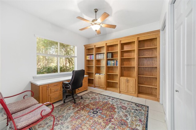 tiled office space with ceiling fan