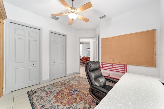 office space featuring light tile patterned floors and ceiling fan