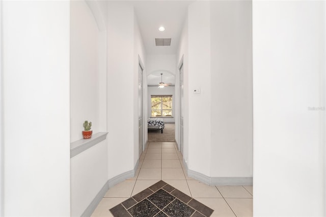 corridor with light tile patterned flooring