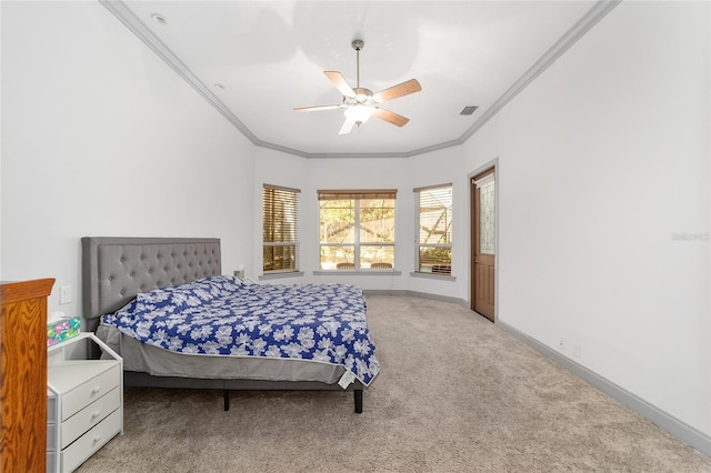 carpeted bedroom featuring ceiling fan and crown molding