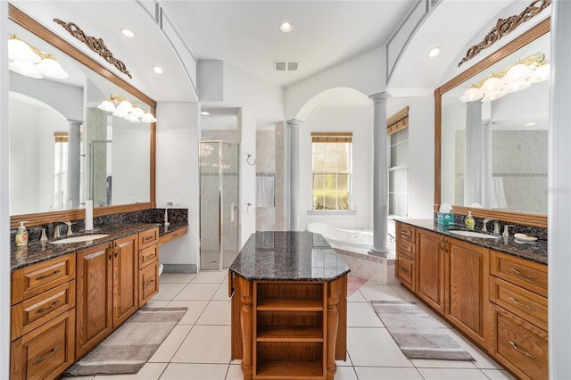 bathroom with vanity, decorative columns, and tile patterned floors