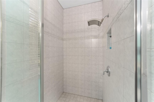 bathroom with a tile shower