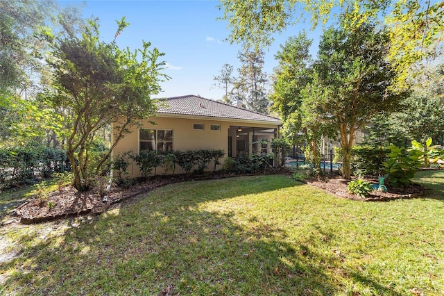 view of yard with a sunroom