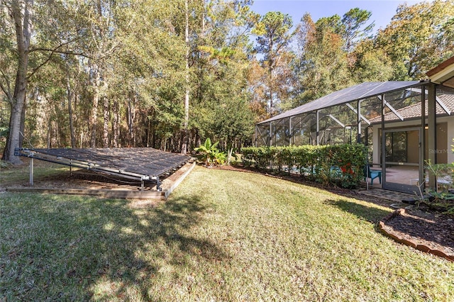 view of yard featuring glass enclosure