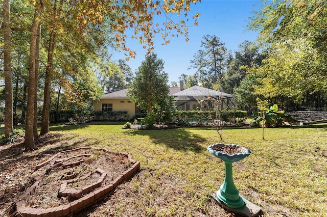 view of yard with a lanai