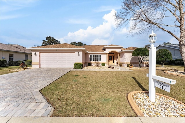 view of front of house featuring a front yard and a garage