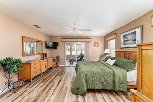 bedroom featuring ceiling fan, light wood-type flooring, and access to outside