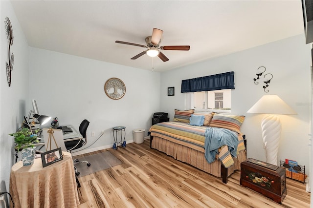 bedroom featuring light hardwood / wood-style floors and ceiling fan