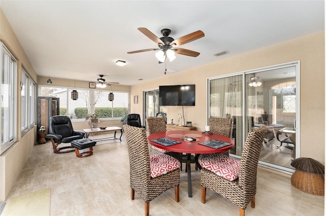 dining area with ceiling fan