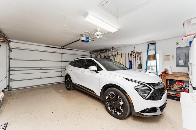 garage featuring ceiling fan and a garage door opener