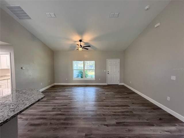 unfurnished living room featuring ceiling fan and dark hardwood / wood-style flooring