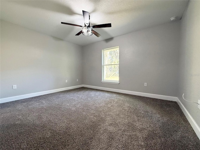 empty room with carpet flooring and ceiling fan