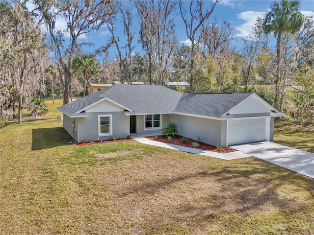 ranch-style home featuring a garage and a front lawn