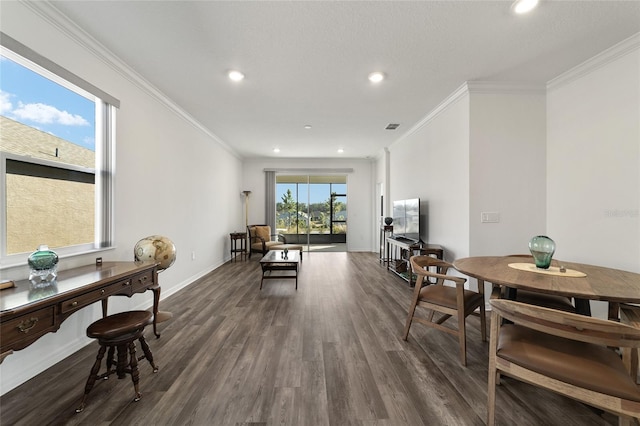 dining area with crown molding and dark hardwood / wood-style flooring