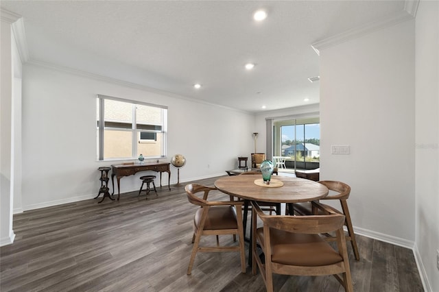 dining room featuring dark hardwood / wood-style floors and ornamental molding