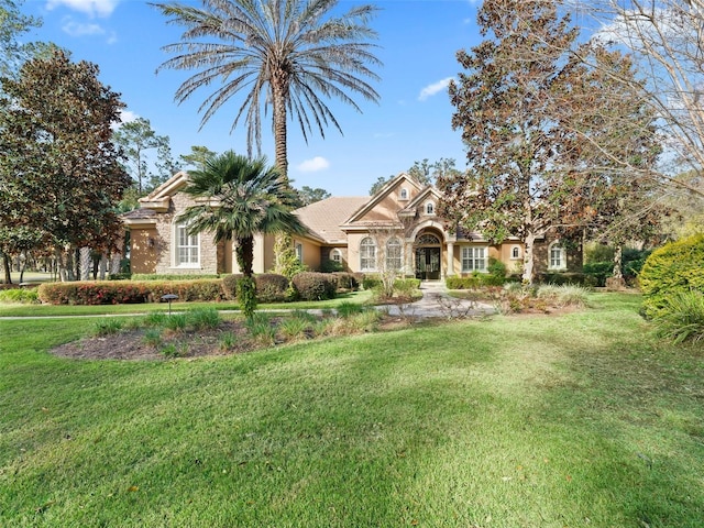 view of front of property with a front lawn