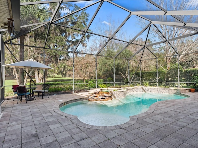 view of pool featuring glass enclosure, an in ground hot tub, and a patio