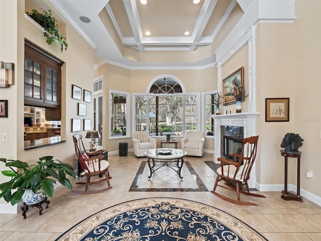 living area featuring tile patterned floors, ornamental molding, coffered ceiling, a premium fireplace, and beamed ceiling