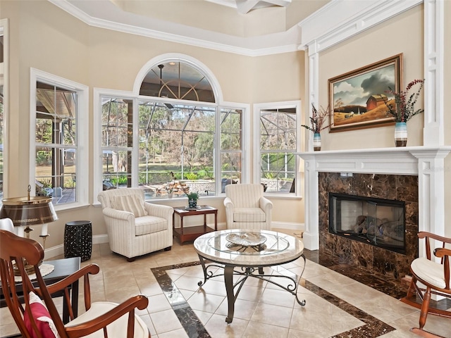 sunroom / solarium featuring a premium fireplace