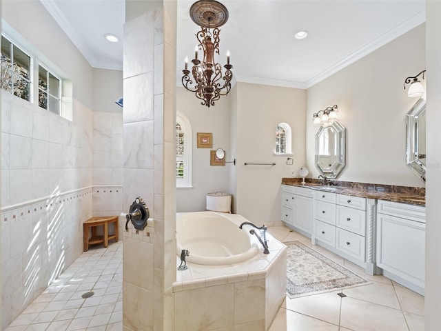 bathroom with an inviting chandelier, tile patterned floors, separate shower and tub, crown molding, and vanity