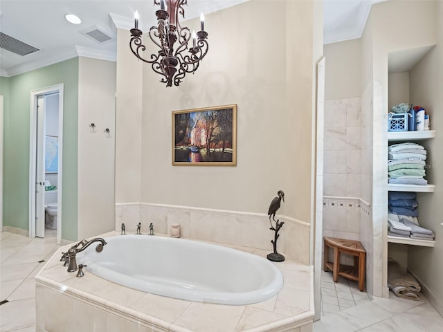 bathroom with tiled bath, crown molding, toilet, and a notable chandelier