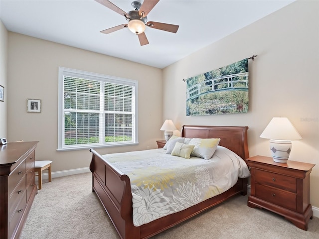 bedroom featuring ceiling fan and light colored carpet