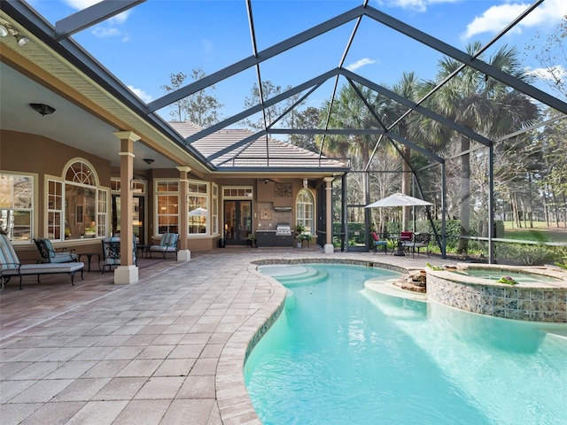 view of swimming pool with glass enclosure, an in ground hot tub, and a patio