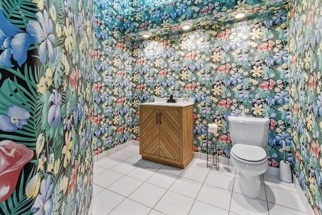 bathroom with tile patterned floors, vanity, and toilet