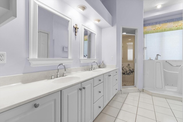 bathroom featuring tile patterned flooring, vanity, and independent shower and bath