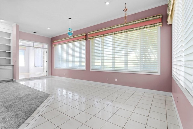 interior space with crown molding and light tile patterned flooring