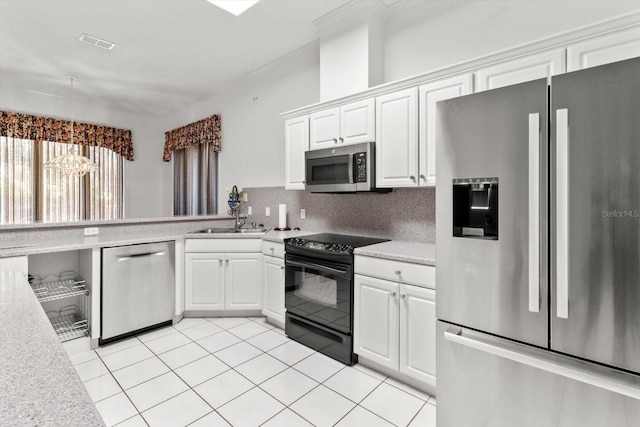 kitchen with sink, light tile patterned floors, tasteful backsplash, white cabinetry, and stainless steel appliances