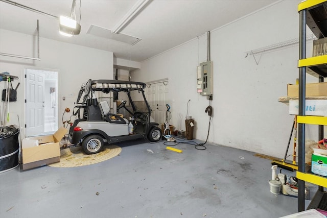 garage featuring electric panel and a garage door opener