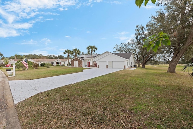 ranch-style house featuring a front yard and a garage