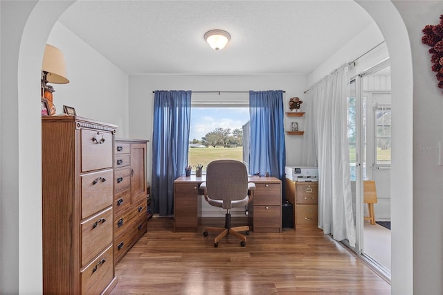 office area featuring hardwood / wood-style floors and a textured ceiling