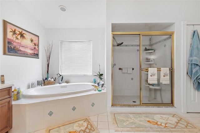 bathroom with tile patterned floors, plus walk in shower, and vanity