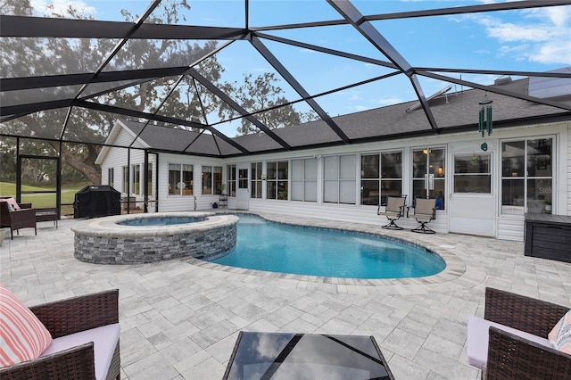 view of pool with glass enclosure, grilling area, an in ground hot tub, and a patio