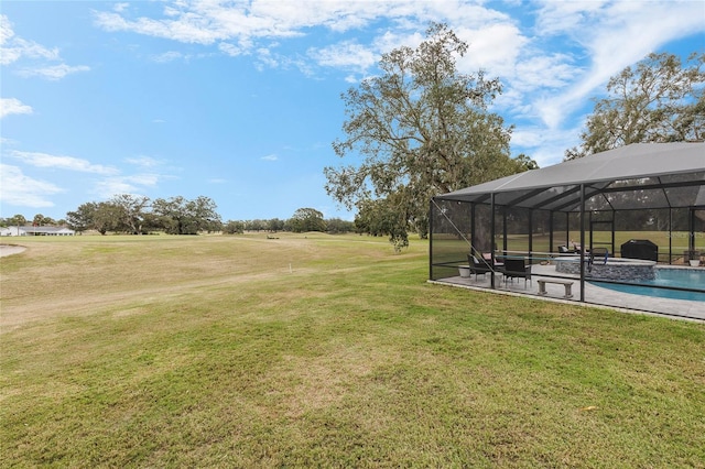 view of yard with glass enclosure