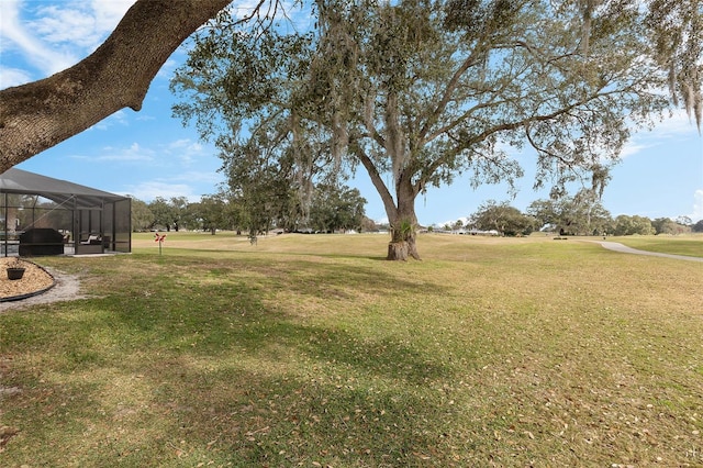 view of yard featuring a lanai