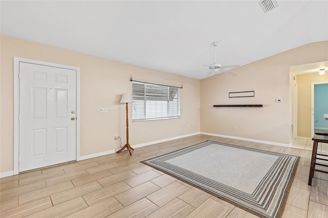 entryway featuring ceiling fan and vaulted ceiling