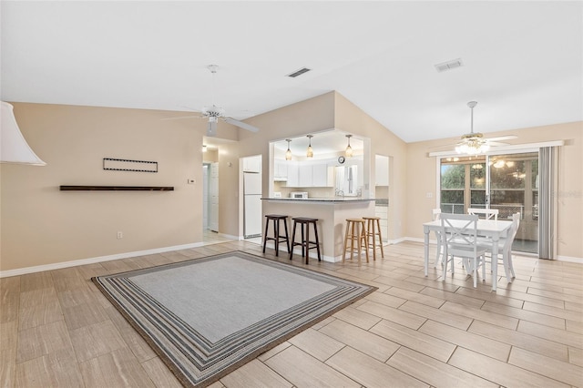 interior space featuring vaulted ceiling and ceiling fan