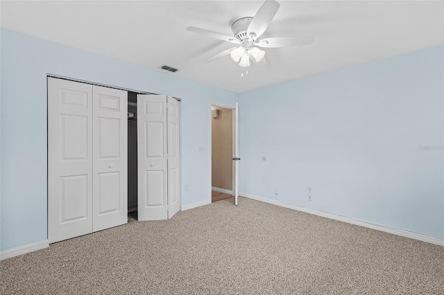 unfurnished bedroom with carpet flooring, a closet, and ceiling fan