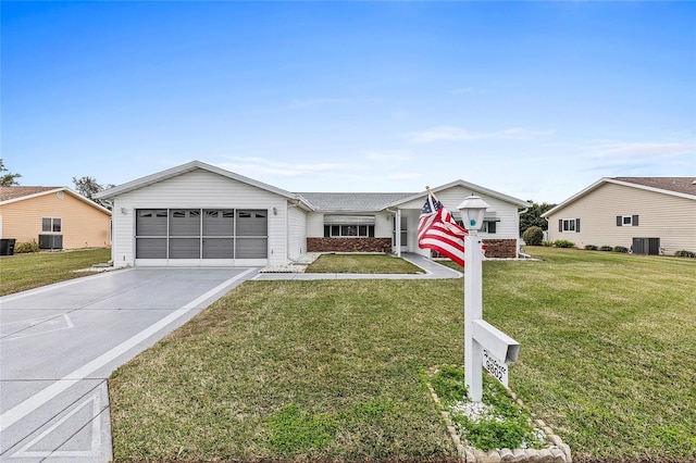 ranch-style home with a front yard and central AC