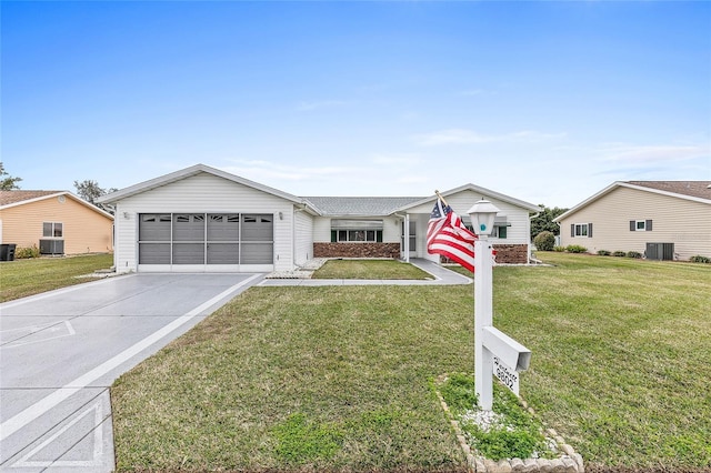 ranch-style house with central AC and a front yard