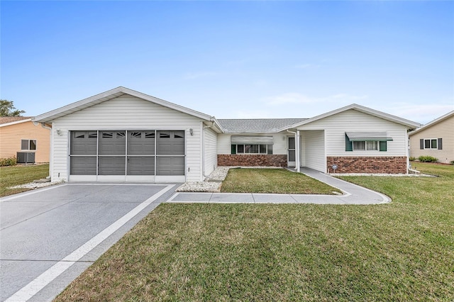 ranch-style home featuring a front yard, a garage, and cooling unit