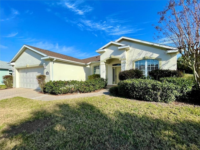 ranch-style house with a front lawn and a garage